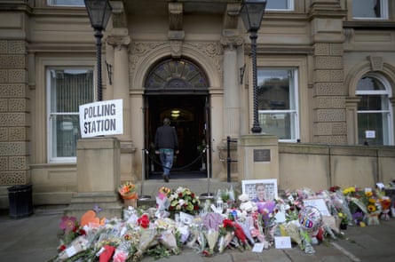 Floral tributes to Jo Cox MP adorn Batley town hall.