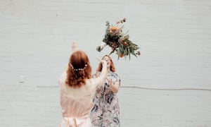 A socially distanced bouquet toss