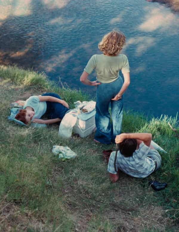 Family by the side of a lake
