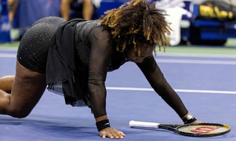 Serena Williams falls to the court on a difficult return.