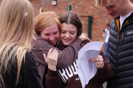 Four pupils collect their GCSE results at a school in North Yorkshire.