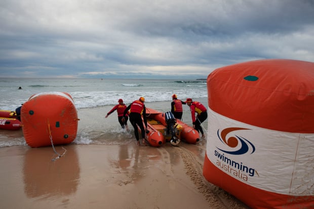 Surf life savers set up for the opening Duel in Pool race – in the open water off Bondi beach.