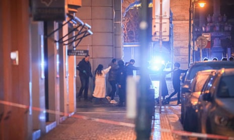 Students of Charles University are being evacuated by police at the location of the shooting on December 21, 2023 in Prague, Czech Republic.