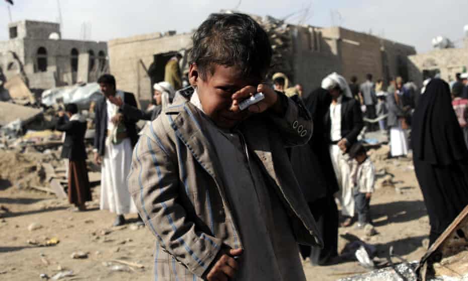 A boy cries near houses hit in airstrikes by the Saudi-led coalition in the Yemeni capital, Sana’a, on Sunday. Six people were killed and seven injured.