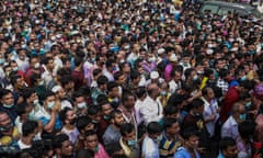 Migrant workers at the Saudi Arabian airline offices in Dhaka, Bangladesh, 4 October.