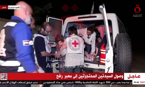 One of the freed hostages is helped into an ambulance by workers from the Red Cross.