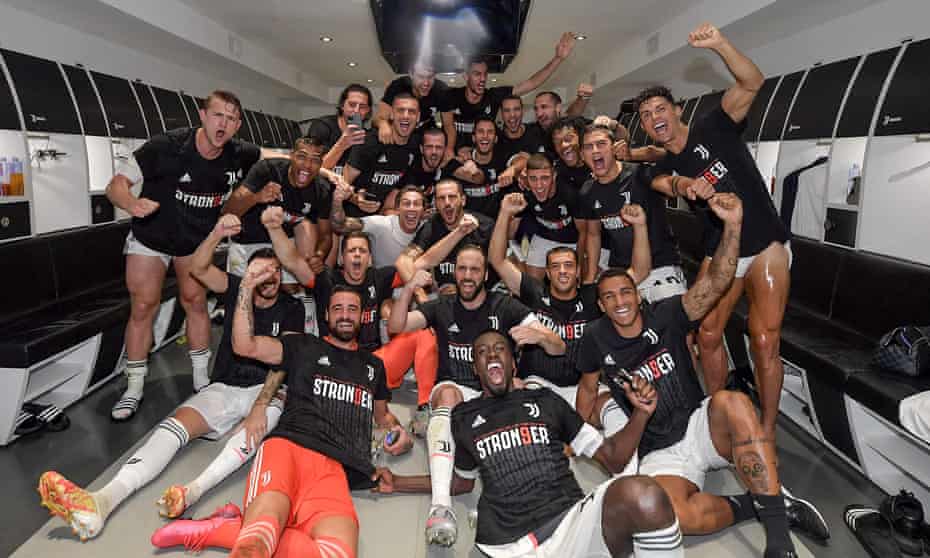 Juventus players celebrate in the dressing room after sealing their ninth consecutive scudetto.