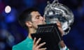Novak Djokovic kisses the Norman Brookes Challenge Cup trophy after his triumph at the Australian Open.