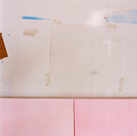 Sheets of paper stuck on a wall, one with a pencil-drawn eye on it