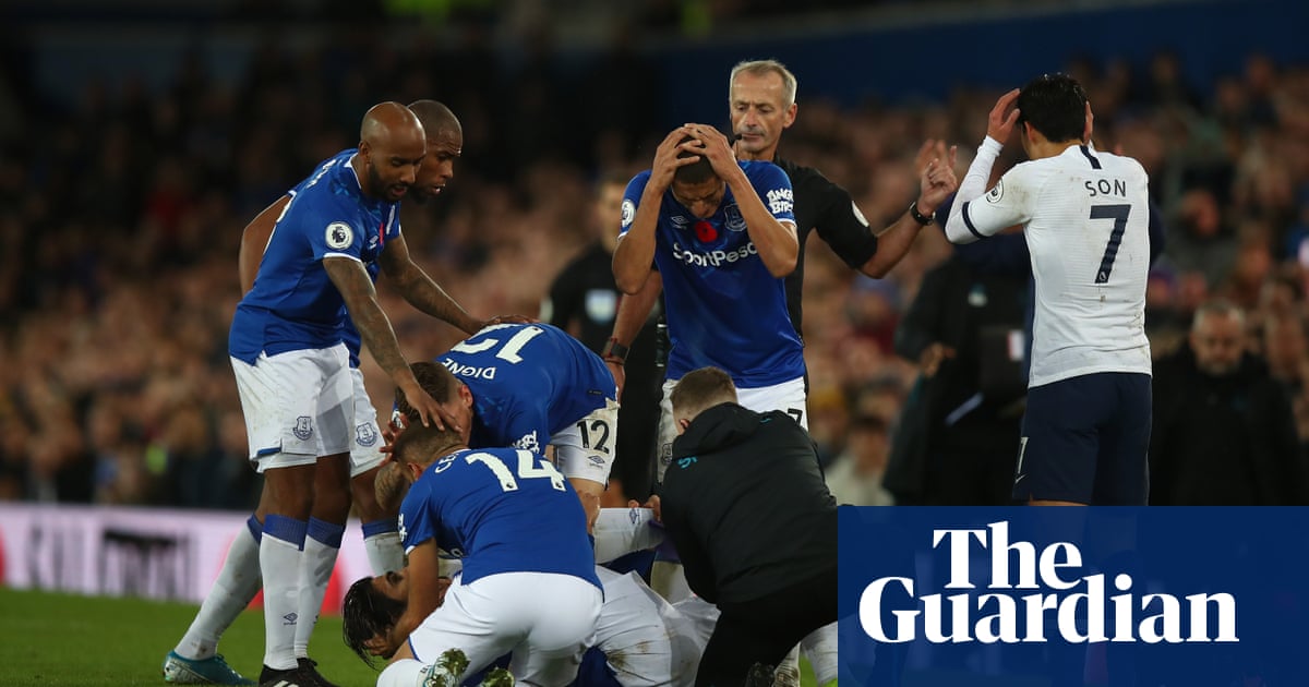 Everton’s Cenk Tosun earns draw with Spurs in game marred by Gomes injury