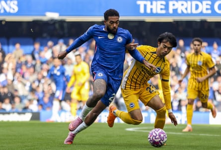 Chelsea's Reece James surges forward as he holds off the challenge of Brighton's Kaoru Mitoma.