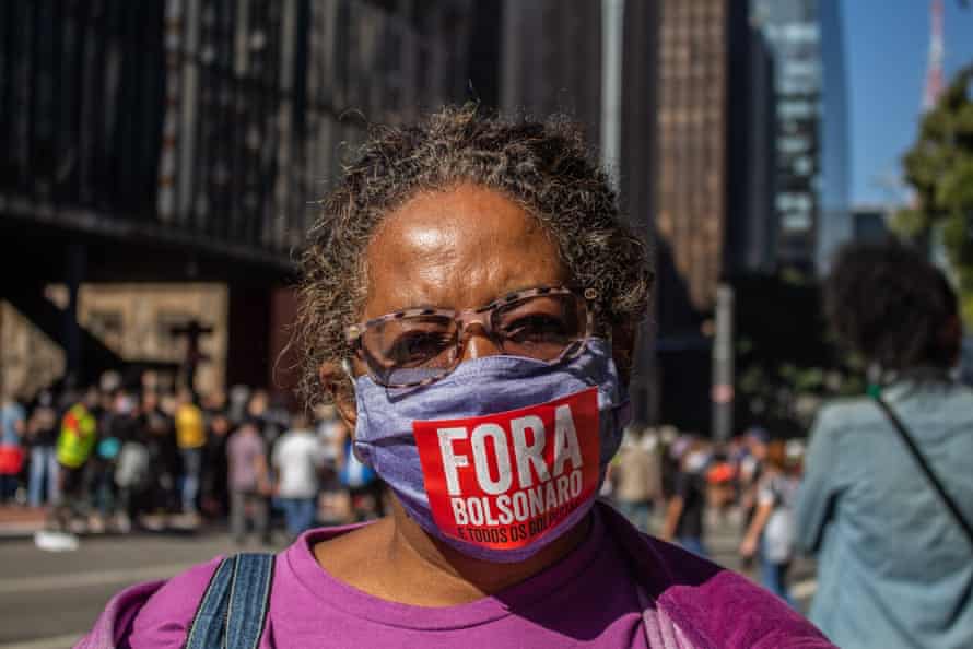 A protester in São Paulo on Sunday, whose masks reads ‘Bolsonaro out’.