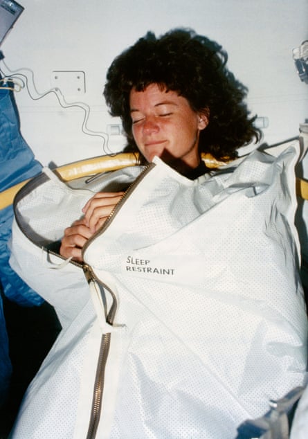 an astronaut attempts to sleep on board a spacecraft