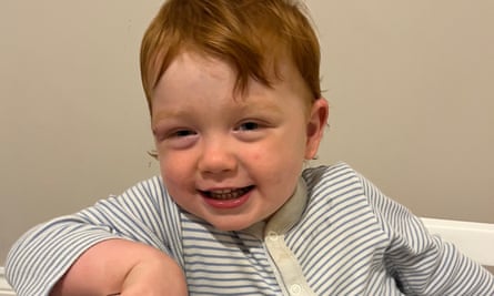 A young boy smiling at the camera