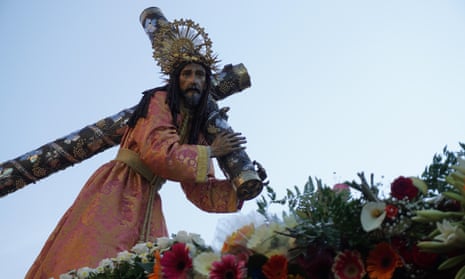 An image of Jesus Christ is carried by devotees taking part in the Jesus of Nazareth Merced procession during Holy Week in Guatemala City