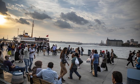 People are seen around the Kadikoy quay during the evening hours in Istanbul’s Kadikoy district.
