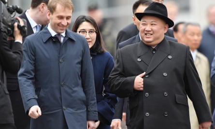 Russia’s Far East development minister, Alexander Kozlov, welcomes Kim.