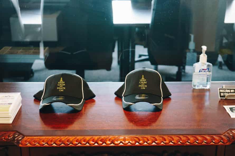 Hats in the office say ‘Keep Calm and Frack On’.