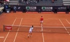 Cameron Norrie smashes ball into Novak Djokovic's legs as world No 1 turns back on net - video