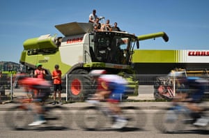 The breakaway cycles past a combine harvester
