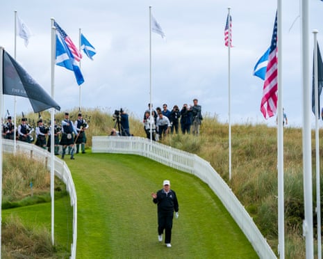 Trump walks onto the first tee of the New Course, the second championship course at Trump International Golf Links, on the Menie Estate in Balmedie, Aberdeenshire.