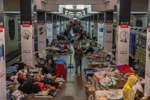 People stay inside a subway station used as a bomb shelter in Kharkiv, northeast Ukraine.