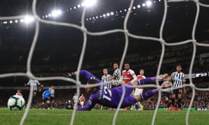 Aaron Ramsey slots the ball past Martin Dubravka for Arsenal’s opener.