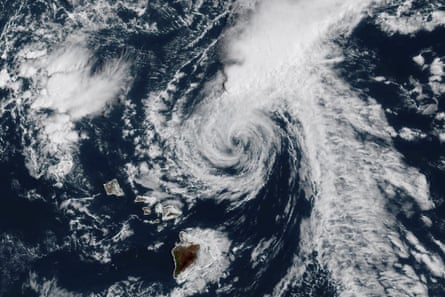 Satellite image of a hurricane – white swirling clouds above sea and islands