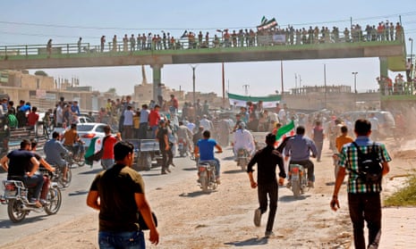 People protest against the Syrian regime and Russia in the rebel-held town of Maarrat al-Numan in the north of Idlib province