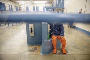 A detainee talks on the phone at the Stewart detention centre in Lumpkin