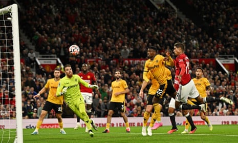 Manchester United’s Raphael Varane scores their first goal past Wolverhampton Wanderers’ keeper Jose Sa.