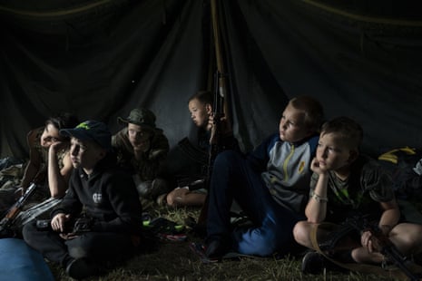 Children with rifles attend a summer camp organised by the nationalist Svoboda party in a village near Ternopil