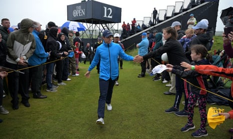 Rory McIlroy greets fans during the final practice round at Royal Portrush.