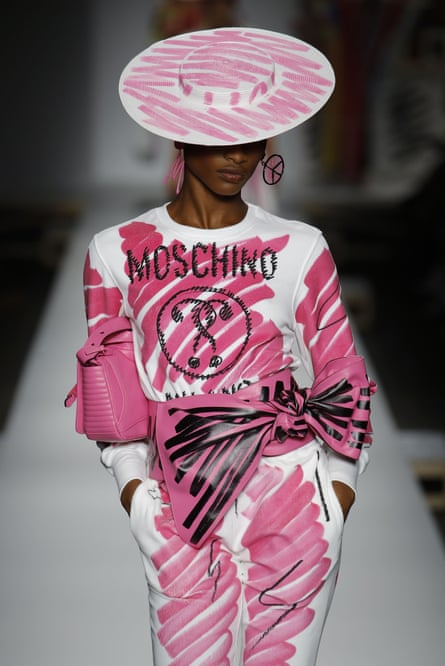 A model in a pink scribble-laden outfit.