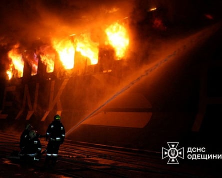 Firefighters tackle a blaze on a civilian vessel