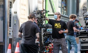 ‘Because everyone is in masks, things are quieter than usual …’ A film crew shooting in Paris last month.