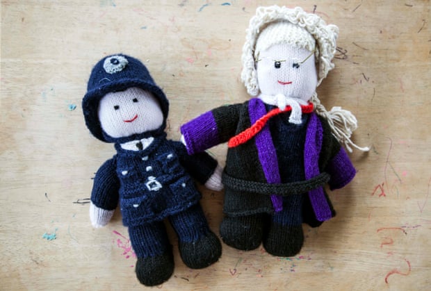 Knitted doll figures of a policeman and judge used by intermediaries who help children give evidence