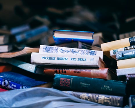 A jumbled pile of books with Cyrillic on their spines, the most prominent reading ‘19th century Russian poets’