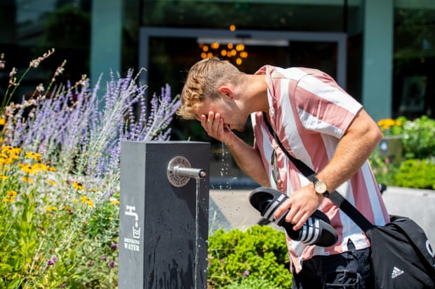 Kieran Sargent from Bristol, who was in London for his birthday, having a drink from a water fountain near St Paul’s Cathedral.