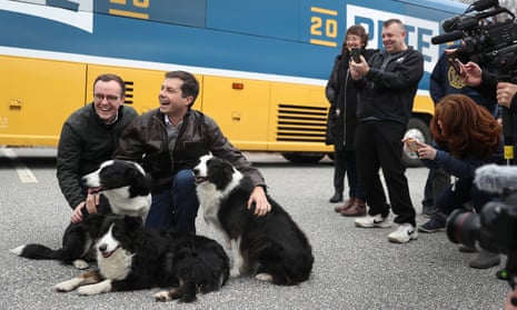 Chasten Buttigieg, left, along with husband Pete and a supporter’s dogs, at a 2020 campaign stop in Claremont, New Hampshire, last month.