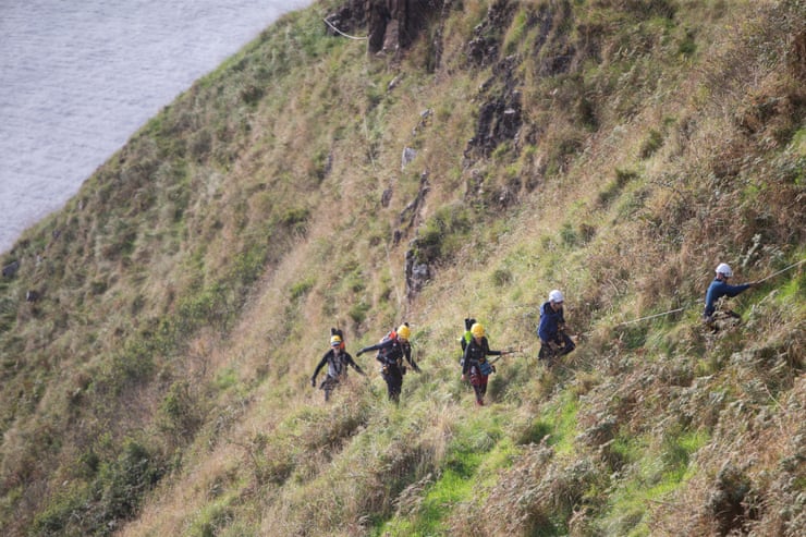 ‘It’s a monster task’: can culling ferrets and rats save one of the UK’s largest seabird colonies? Professional climbers assist members of the Life Raft project along the island's dangerous cliff areas.Photograph: Paul McErlane/The Guardian