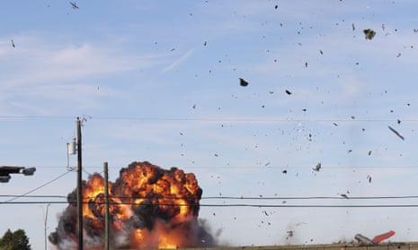 A historic military plane crashes after colliding with another plane during the airshow.