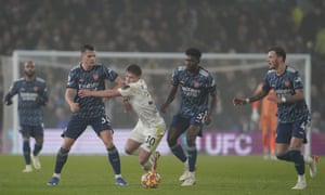 Leeds United's Joe Gelhardt (centre) is closed down by Arsenal's Granit Xhaka (left) and Arsenal's Thomas Partey.