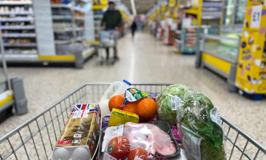 A customer shops for food items inside a Tesco supermarket store in east London in April 2022.