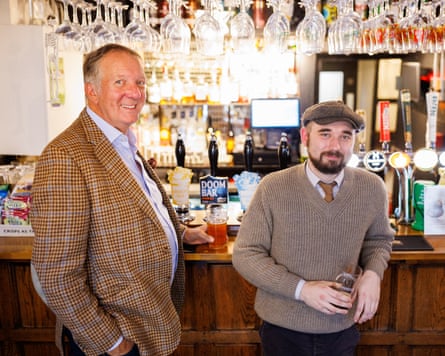 Osborne, left, and Morton stand at the bar.