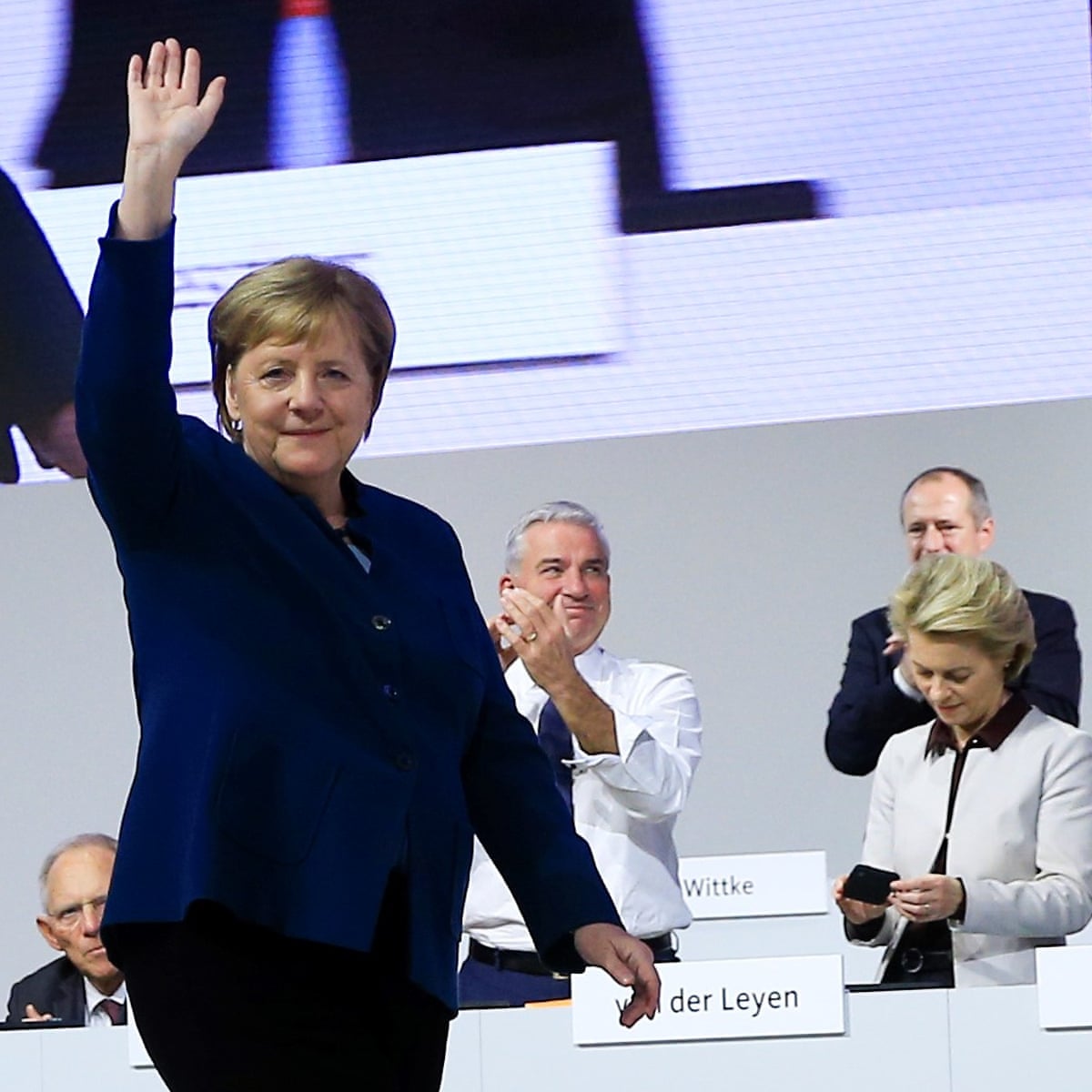 Merkel bows out to applause as CDU votes on successor | Germany | The Guardian