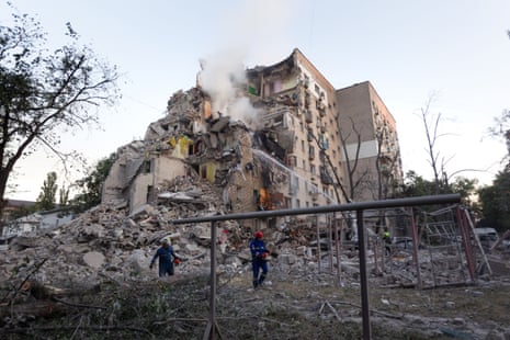 Rescuers conduct search and rescue operations at a multi-storey residential building damaged in a massive Russian missile and drone attack in the Darnytskyi district of Kyiv, Ukraine.