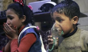 An image released by the Syrian White Helmets, shows a child receiving oxygen following a suspected sarin attack in Douma.