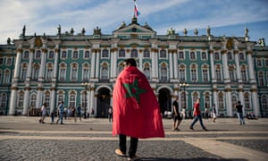 A Morocco supporter in front of the State Hermitage museum in St Petersburg