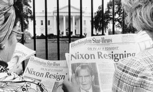 Newspaper headlines about President Nixon's resignation being read by tourists in front of the White House.